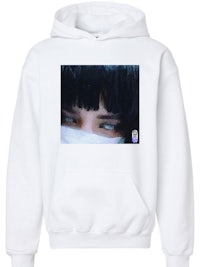 a white hoodie with an image of a girl with black hair