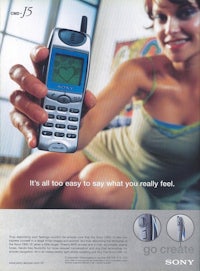 a woman is holding a sony cell phone