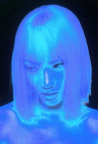 a woman with blue hair in front of a blue light